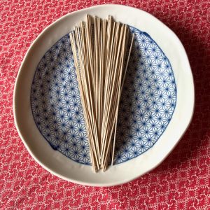 light brown coloured soba noodles fanned on a blue and white asymetrical plate on red table cloth soba noodle salad recipe Gill Stannard Naturopath Australia