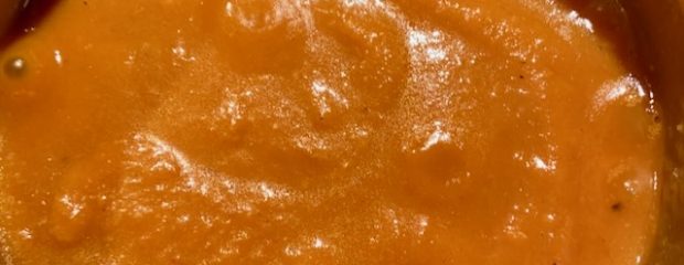 deep orange pumpkin and potatosoup bubbling in pot